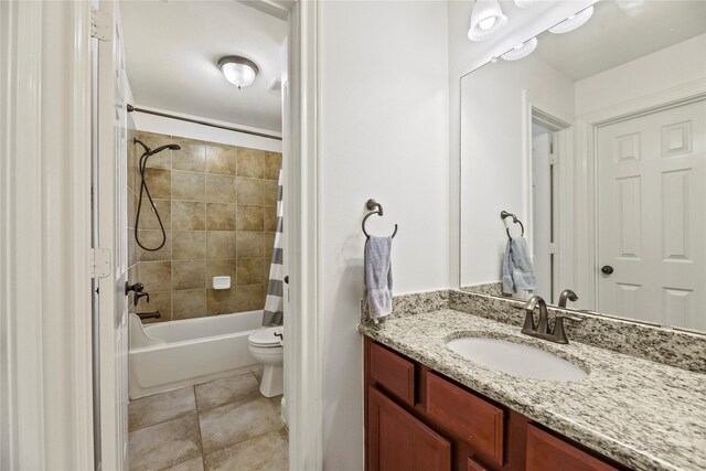 9210 Cold Hollow Ln, Missouri City, TX 77459 - bathroom featuring vanity, toilet, shower / tub combo, and tile patterned floors