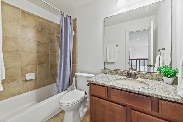 9210 Cold Hollow Ln, Missouri City, TX 77459 - full bathroom featuring toilet, vanity, shower / bath combo with shower curtain, and tile patterned flooring
