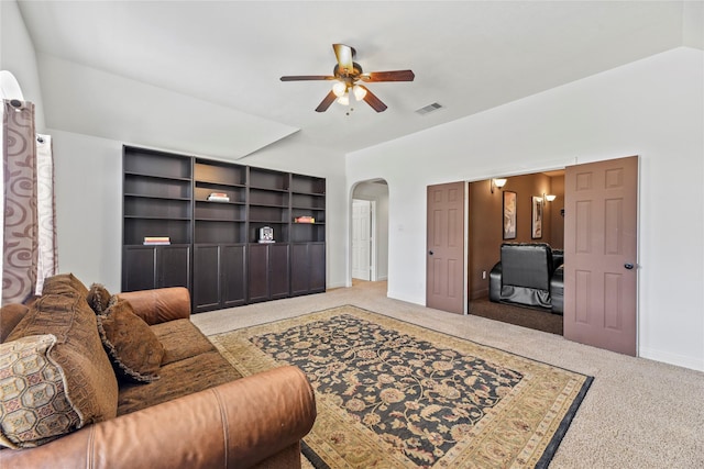 9210 Cold Hollow Ln, Missouri City, TX 77459 - living area with carpet floors, ceiling fan, arched walkways, and baseboards