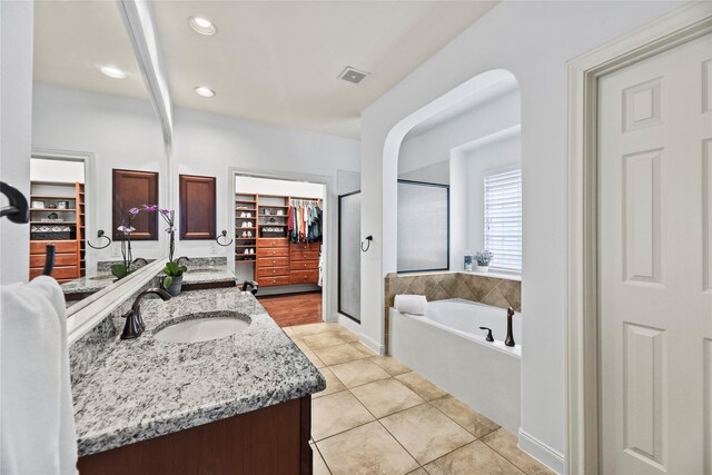 9210 Cold Hollow Ln, Missouri City, TX 77459 - full bath featuring a bath, tile patterned flooring, vanity, recessed lighting, and a stall shower