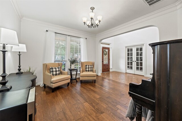 9210 Cold Hollow Ln, Missouri City, TX 77459 - sitting room with crown molding, a chandelier, hardwood / wood-style floors, french doors, and baseboards