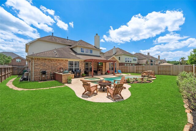 9210 Cold Hollow Ln, Missouri City, TX 77459 - rear view of property featuring an outdoor fire pit, a patio area, a chimney, brick siding, and roof with shingles