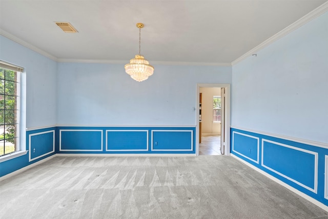 21735 Cayman Point Dr, Katy, TX 77450 - carpeted empty room with a chandelier, ornamental molding, a wainscoted wall, and a decorative wall