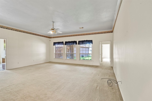 21735 Cayman Point Dr, Katy, TX 77450 - carpeted empty room featuring crown molding, a ceiling fan, and baseboards