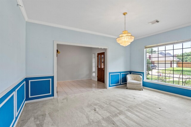 21735 Cayman Point Dr, Katy, TX 77450 - spare room featuring crown molding, a chandelier, carpet floors, and a wainscoted wall