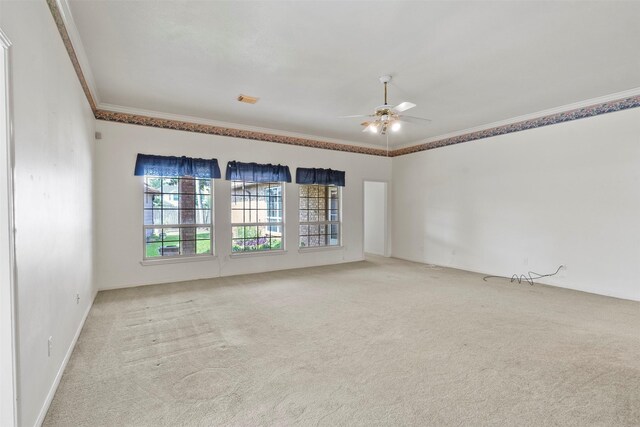 21735 Cayman Point Dr, Katy, TX 77450 - spare room with ornamental molding, light carpet, and ceiling fan