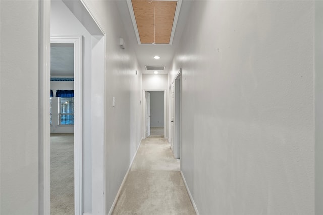 21735 Cayman Point Dr, Katy, TX 77450 - corridor featuring attic access, light colored carpet, and baseboards