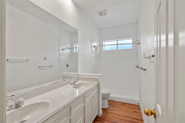 21735 Cayman Point Dr, Katy, TX 77450 - full bath featuring toilet, a shower, wood finished floors, and double vanity