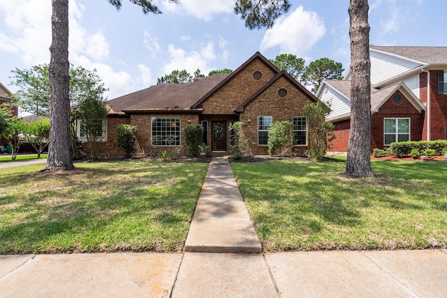 21735 Cayman Point Dr, Katy, TX 77450 - view of front of home featuring brick siding and a front lawn