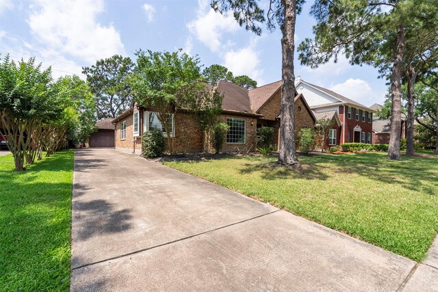 21735 Cayman Point Dr, Katy, TX 77450 - view of front facade featuring brick siding and a front lawn