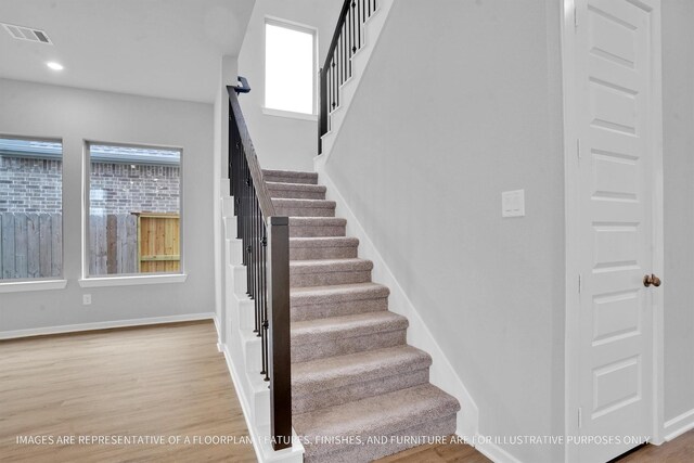 2808 Gran Castillo Dr, Texas City, TX 77568 - stairway featuring wood finished floors, baseboards, and recessed lighting