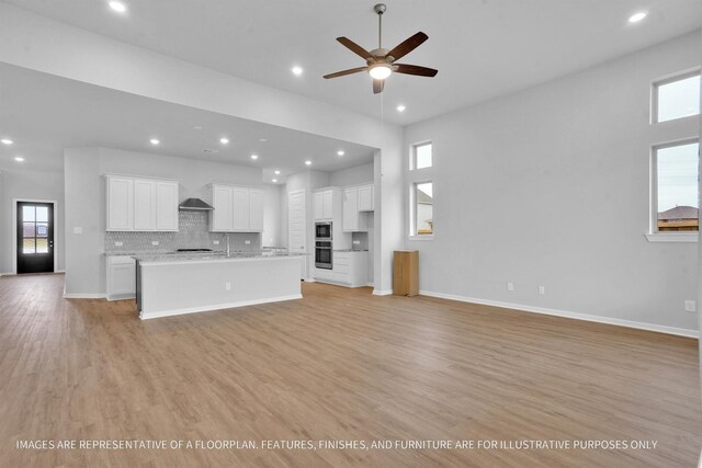 2808 Gran Castillo Dr, Texas City, TX 77568 - unfurnished living room featuring recessed lighting, ceiling fan, light wood finished floors, and baseboards