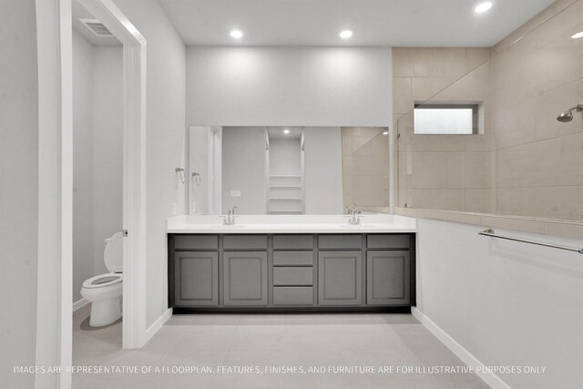 2808 Gran Castillo Dr, Texas City, TX 77568 - full bathroom with double vanity, toilet, recessed lighting, tiled shower, and tile patterned floors