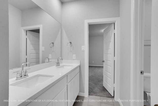 2808 Gran Castillo Dr, Texas City, TX 77568 - bathroom featuring double vanity, tile patterned flooring, toilet, and baseboards