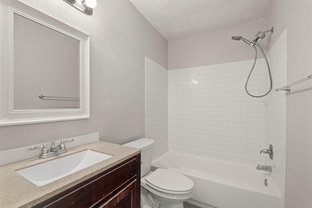 9219 Goodmeadow Dr, Houston, TX 77064 - bathroom featuring a textured ceiling, toilet, vanity, washtub / shower combination, and a textured wall