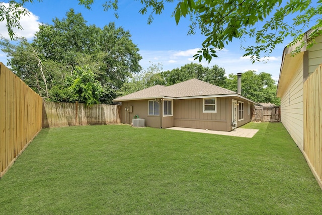 9219 Goodmeadow Dr, Houston, TX 77064 - rear view of house with central AC unit, a patio, roof with shingles, and board and batten siding