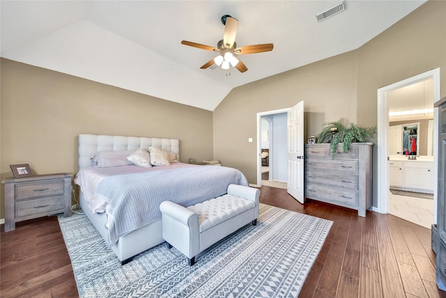 61 Chicory Ct, Lake Jackson, TX 77566 - bedroom with dark wood-style flooring, vaulted ceiling, connected bathroom, and a ceiling fan