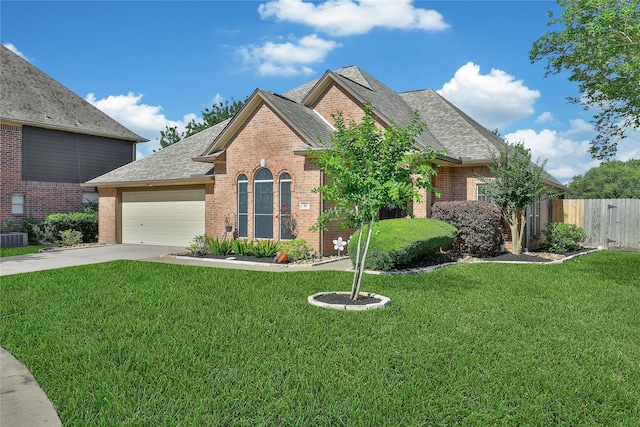 61 Chicory Ct, Lake Jackson, TX 77566 - view of front facade featuring brick siding, a garage, concrete driveway, and roof with shingles