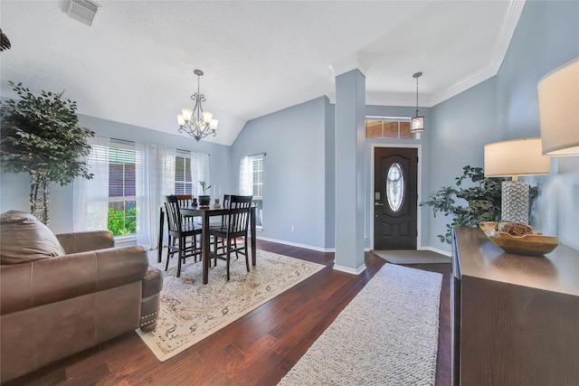 61 Chicory Ct, Lake Jackson, TX 77566 - foyer with dark wood finished floors, a chandelier, baseboards, ornamental molding, and lofted ceiling