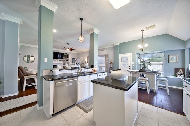 61 Chicory Ct, Lake Jackson, TX 77566 - kitchen featuring dishwasher, a sink, dark countertops, open floor plan, and ceiling fan