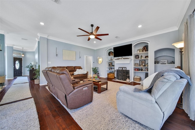 61 Chicory Ct, Lake Jackson, TX 77566 - living room featuring a ceiling fan, wood finished floors, built in features, ornamental molding, and a fireplace with flush hearth