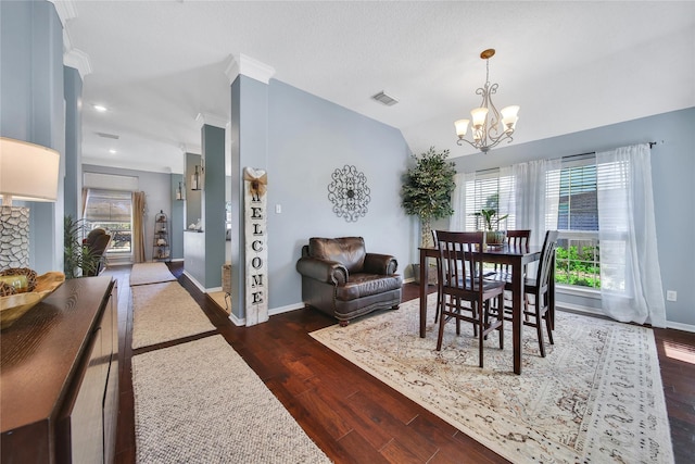 61 Chicory Ct, Lake Jackson, TX 77566 - dining space featuring a chandelier, lofted ceiling, dark wood-type flooring, and baseboards