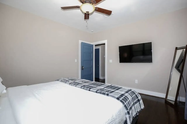4434 Leeland St, Houston, TX 77023 - bedroom with wood finished floors, a ceiling fan, and baseboards