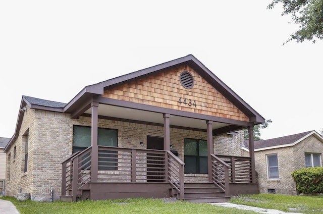 4434 Leeland St, Houston, TX 77023 - view of front of property with covered porch and brick siding