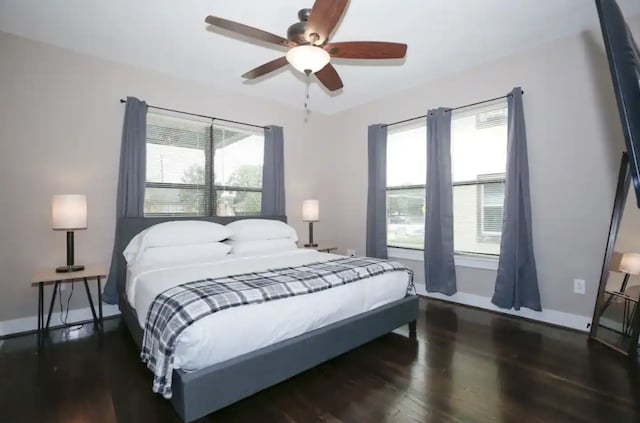4434 Leeland St, Houston, TX 77023 - bedroom with wood finished floors, ceiling fan, and baseboards