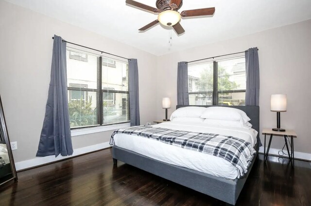 4434 Leeland St, Houston, TX 77023 - bedroom with wood finished floors, baseboards, and multiple windows