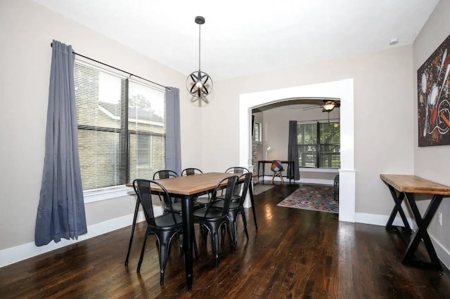 4434 Leeland St, Houston, TX 77023 - dining space with arched walkways, wood finished floors, and baseboards