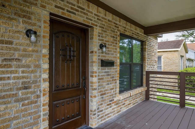 4434 Leeland St, Houston, TX 77023 - view of exterior entry featuring brick siding and a porch