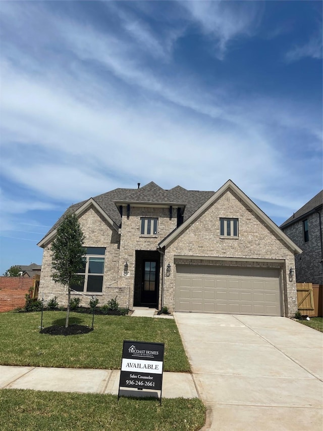 2908 Apple Rose Ln, Katy, TX 77493 - view of front of property with driveway, an attached garage, brick siding, and roof with shingles