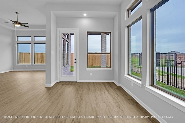 2908 Apple Rose Ln, Katy, TX 77493 - foyer featuring wood finished floors, a ceiling fan, and baseboards