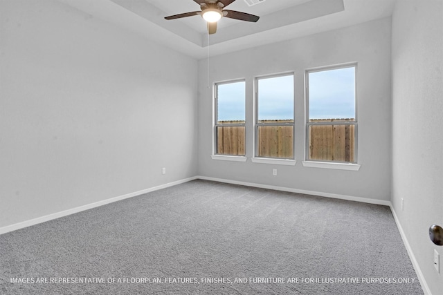 2908 Apple Rose Ln, Katy, TX 77493 - carpeted spare room featuring a ceiling fan, baseboards, and a raised ceiling