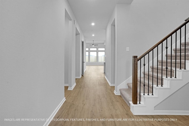 2908 Apple Rose Ln, Katy, TX 77493 - hall featuring wood finished floors, baseboards, stairs, and recessed lighting
