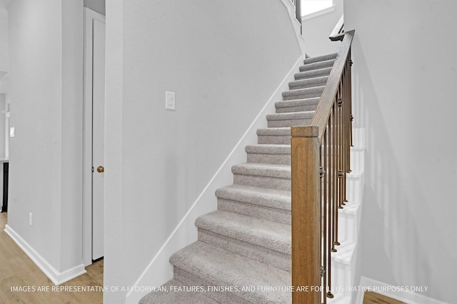 2908 Apple Rose Ln, Katy, TX 77493 - staircase featuring wood finished floors and baseboards