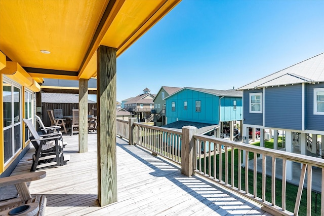 2932 Lakeside Dr, Crystal Beach, TX 77650 - wooden deck with a residential view