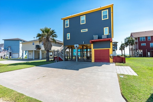 2932 Lakeside Dr, Crystal Beach, TX 77650 - view of front facade featuring a carport, driveway, stairs, and a front lawn