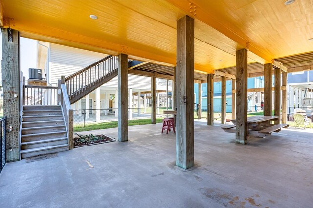 2932 Lakeside Dr, Crystal Beach, TX 77650 - view of patio / terrace featuring stairway, central AC, and fence