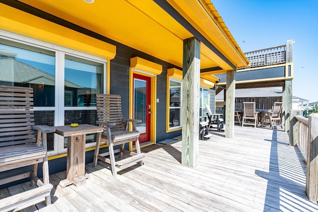 2932 Lakeside Dr, Crystal Beach, TX 77650 - wooden deck with outdoor dining space