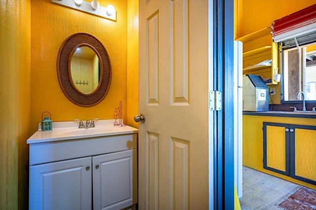 2932 Lakeside Dr, Crystal Beach, TX 77650 - bathroom with wood finished floors and vanity