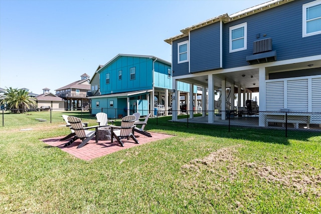 2932 Lakeside Dr, Crystal Beach, TX 77650 - back of house with an outdoor fire pit and a patio area