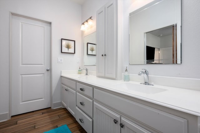 2932 Lakeside Dr, Crystal Beach, TX 77650 - full bath with wood finished floors and double vanity