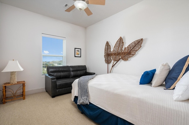 2932 Lakeside Dr, Crystal Beach, TX 77650 - bedroom featuring light carpet, a ceiling fan, and baseboards