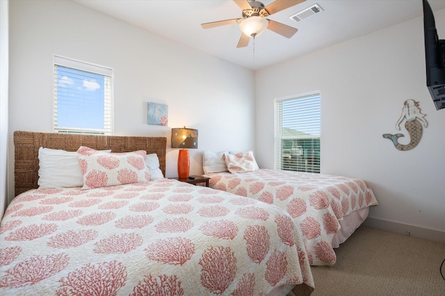 2932 Lakeside Dr, Crystal Beach, TX 77650 - bedroom featuring carpet flooring, ceiling fan, and baseboards
