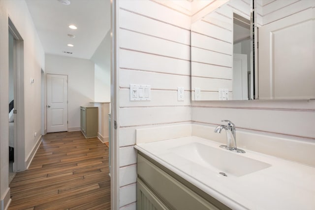 2932 Lakeside Dr, Crystal Beach, TX 77650 - bathroom with wood finished floors, baseboards, recessed lighting, and vanity