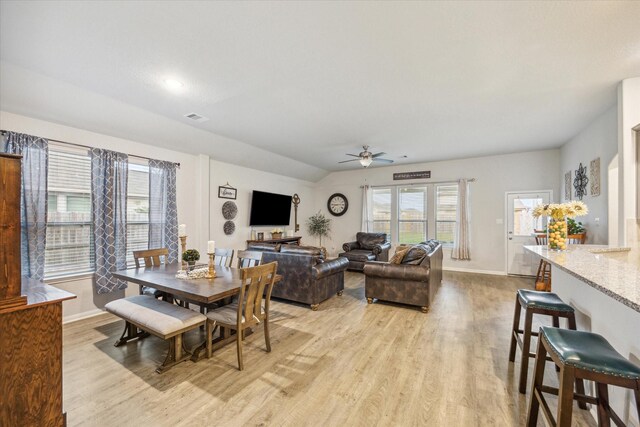 310 Morning Dove Trl, Sealy, TX 77474 - dining space with a ceiling fan, light wood-style flooring, and baseboards