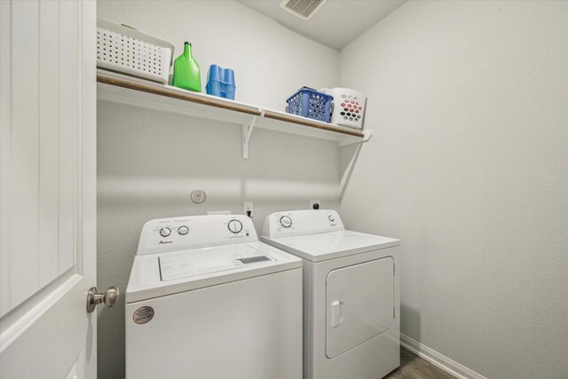 310 Morning Dove Trl, Sealy, TX 77474 - laundry room with independent washer and dryer, baseboards, and dark wood-style floors