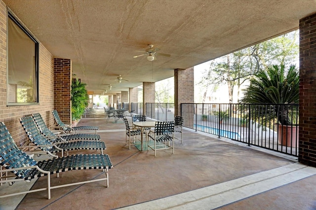 view of patio with ceiling fan and outdoor dining space
